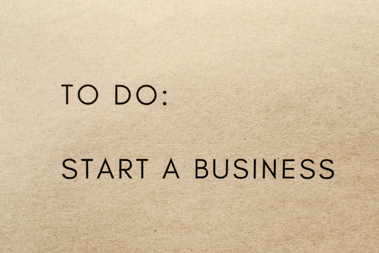 A close-up shot of a to-do list with 'Start a Business' written on it.